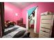Small bedroom showcasing a single bed and closet at 14210 Downing St, Dover, FL 33527