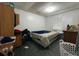 Bedroom featuring a bed, small closet and white walls at 14210 Downing St, Dover, FL 33527