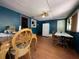 Traditional dining room, featuring wood table set and vinyl flooring at 14210 Downing St, Dover, FL 33527