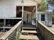 Exterior of a home with a porch, wooden steps, and white siding at 14210 Downing St, Dover, FL 33527