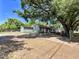 Traditional home exterior with a tree-covered yard at 14210 Downing St, Dover, FL 33527