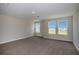 Spacious carpeted bedroom with ample natural light from multiple windows and neutral color palette at 14411 Meadow Bird Ave, Riverview, FL 33579