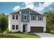 Inviting two-story home with a modern design, featuring a blue and white color scheme at 14411 Meadow Bird Ave, Riverview, FL 33579