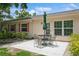 Outdoor patio with a table and chairs, perfect for enjoying the backyard at 1535 Nursery Rd # 110, Clearwater, FL 33756