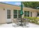 Outdoor patio with table and chairs, ideal for relaxation and outdoor dining at 1535 Nursery Rd # 110, Clearwater, FL 33756