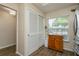 Bright kitchen featuring natural light, storage, and a view of the front yard from the breakfast nook area at 1535 Nursery Rd # 110, Clearwater, FL 33756