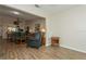 Open-concept living room featuring wood floors and a view into the dining and kitchen areas at 1535 Nursery Rd # 110, Clearwater, FL 33756