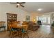 Open floor plan living and dining area with wood-look floors at 1535 Nursery Rd # 110, Clearwater, FL 33756