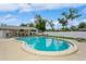 Well-kept community pool, partially fenced, with comfortable lounge seating and ample deck space at 1535 Nursery Rd # 110, Clearwater, FL 33756