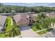 Expansive aerial view of a home with meticulous landscaping and a spacious brick driveway at 16248 Ivy Lake Dr, Odessa, FL 33556