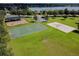 Community park with playground, basketball court, sand volleyball court, and parking area at 16248 Ivy Lake Dr, Odessa, FL 33556