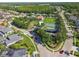 Aerial view of the community park, basketball court, and green space surrounded by neighborhood homes at 16248 Ivy Lake Dr, Odessa, FL 33556