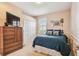 Cozy bedroom with nautical accents, window with shutters, and a spacious closet at 16248 Ivy Lake Dr, Odessa, FL 33556