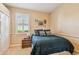 Bedroom with a neutral color palette, window with shutters, and wood nightstand at 16248 Ivy Lake Dr, Odessa, FL 33556