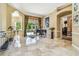 Elegant foyer featuring marble floors, neutral walls, and a glimpse of the pool and backyard at 16248 Ivy Lake Dr, Odessa, FL 33556