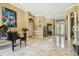 Grand foyer with marble flooring, high ceilings, and a glimpse of the office and dining area at 16248 Ivy Lake Dr, Odessa, FL 33556