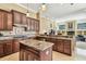 Well-equipped kitchen with granite countertops, wood cabinets, and stainless steel appliances at 16248 Ivy Lake Dr, Odessa, FL 33556