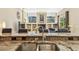 A kitchen featuring granite countertops, a stainless steel sink, and a view into the living room at 16248 Ivy Lake Dr, Odessa, FL 33556