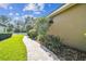 Manicured walkway featuring flower beds and lush green landscaping at 16248 Ivy Lake Dr, Odessa, FL 33556
