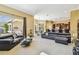 Expansive living room with open layout, flowing to outdoor patio and kitchen at 16248 Ivy Lake Dr, Odessa, FL 33556