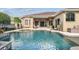 Back of house featuring a private pool and spa, perfect for relaxing and entertaining at 16248 Ivy Lake Dr, Odessa, FL 33556