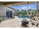 Covered outdoor area with pool, cabana, and outdoor kitchen at 16248 Ivy Lake Dr, Odessa, FL 33556