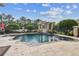 Backyard pool with a hot tub, cabana, and meticulous landscaping at 16248 Ivy Lake Dr, Odessa, FL 33556