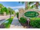 Elegant stone entrance sign reading 'Ivy Lake Estates' surrounded by manicured landscaping at 16248 Ivy Lake Dr, Odessa, FL 33556