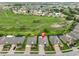 Overhead view of the property and surrounding neighborhood shows community layout and lush landscaping at 1723 Pacific Dunes Dr, Sun City Center, FL 33573