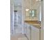 Cozy bathroom with granite countertops, shower, and decorative finishes at 1723 Pacific Dunes Dr, Sun City Center, FL 33573