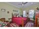 Cozy bedroom with hardwood floors, ample natural light, and decorative accents at 1723 Pacific Dunes Dr, Sun City Center, FL 33573