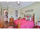 Comfortable bedroom with hardwood floors and easy access to the ensuite bathroom at 1723 Pacific Dunes Dr, Sun City Center, FL 33573