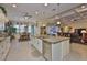 Kitchen with stainless steel appliances and a view of the living room and dining room at 1723 Pacific Dunes Dr, Sun City Center, FL 33573