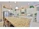 Well-equipped kitchen featuring granite countertops, stainless steel appliances, and ample cabinet space for organized living at 1723 Pacific Dunes Dr, Sun City Center, FL 33573