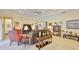 A living room with comfortable seating, decor, and a view to a nearby doorway at 1723 Pacific Dunes Dr, Sun City Center, FL 33573