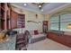 Study with custom built-ins, leather chair, and decorative elements at 1723 Pacific Dunes Dr, Sun City Center, FL 33573