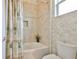 Shower with tan tile and glass door at 1723 Pacific Dunes Dr, Sun City Center, FL 33573