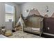Charming Bedroom with mountain mural and decorative teepee providing a delightful space at 18596 Rococo Rd, Spring Hill, FL 34610