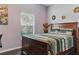 Cozy bedroom with a view of the outdoors and hardwood floors for enhanced comfort and style at 18596 Rococo Rd, Spring Hill, FL 34610