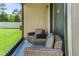 Relaxing screened patio with wicker furniture providing an ideal outdoor living space at 18596 Rococo Rd, Spring Hill, FL 34610