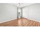 Comfortable bedroom with wood floor, light gray walls, and double door closet at 18712 Forest Glen Ct, Tampa, FL 33647