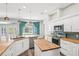 Well-lit kitchen with modern appliances, a stylish island, and charming breakfast nook at 18712 Forest Glen Ct, Tampa, FL 33647