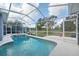 Relaxing screened-in pool with a jacuzzi, perfect for outdoor entertaining and enjoying the Florida lifestyle at 18712 Forest Glen Ct, Tampa, FL 33647
