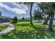 Lush backyard with an inground pool and screened enclosure, providing a private outdoor oasis at 1899 Oak Park S Dr, Clearwater, FL 33764