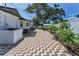 An expansive backyard featuring a stylish brick paved area that adds character and charm to the property at 1899 Oak Park S Dr, Clearwater, FL 33764