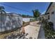 Exterior backyard view, showcasing brick and concrete pavers, storage shed, and a garden area, creating a functional and attractive outdoor space at 1899 Oak Park S Dr, Clearwater, FL 33764