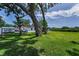 Expansive backyard with mature trees providing ample shade and privacy; ideal for outdoor activities at 1899 Oak Park S Dr, Clearwater, FL 33764