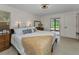 Cozy bedroom featuring a queen-sized bed, dresser, and sliding glass doors to a pool at 1899 Oak Park S Dr, Clearwater, FL 33764