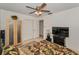 Bedroom featuring a ceiling fan, closet, wood accents, and doorway at 1899 Oak Park S Dr, Clearwater, FL 33764