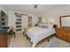 Bedroom featuring a queen-sized bed and ensuite bathroom with sliding glass door at 1899 Oak Park S Dr, Clearwater, FL 33764